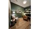 Cozy home office with built-in shelving, earth tone color scheme, and ample workspace at 15455 Canyon Rim Dr # 307, Englewood, CO 80112