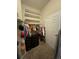 Organized walk-in closet with shelving, hanging rods, and storage drawers at 15455 Canyon Rim Dr # 307, Englewood, CO 80112