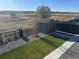 Backyard features shed, gravel, lawn area, and open view beyond black fence at 13432 Broad Wing Dr, Parker, CO 80134