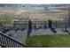 Spacious backyard with a fence, lush grass, gravel area, and newly planted trees at 13432 Broad Wing Dr, Parker, CO 80134