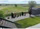 Landscaped backyard featuring green lawn, gravel bed, fence and shed with views of open space beyond at 13432 Broad Wing Dr, Parker, CO 80134