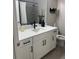 Stylish bathroom features modern fixtures, white cabinets, and a shower with black trim at 13432 Broad Wing Dr, Parker, CO 80134