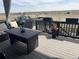 Outdoor deck with patio furniture, flowers, and scenic views of the surrounding landscape at 13432 Broad Wing Dr, Parker, CO 80134