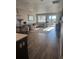 Bright and spacious living room with wood floors, modern furniture, and lots of natural light at 13432 Broad Wing Dr, Parker, CO 80134