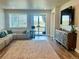 Comfortable living room features a sliding glass door offering stunning views of the outdoors at 13432 Broad Wing Dr, Parker, CO 80134