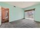 Bedroom featuring gray carpet, natural light and en-suite entrance at 2985 Blue Sky Cir # 7-107, Erie, CO 80516