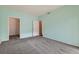 A bright bedroom with soft carpeting, a closet and easy access to other rooms at 2985 Blue Sky Cir # 7-107, Erie, CO 80516