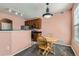 Cozy dining area with a round wooden table, set near the kitchen, creating a warm and inviting space at 2985 Blue Sky Cir # 7-107, Erie, CO 80516