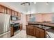 Well-lit kitchen featuring stainless steel appliances, granite countertops, and ample cabinet space, perfect for cooking at 2985 Blue Sky Cir # 7-107, Erie, CO 80516