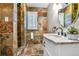 Bathroom with stand up shower and patterned tiling throughout at 19070 White Fawn Dr, Monument, CO 80132
