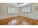 Bedroom with hardwood floors, a ceiling fan and plenty of light at 19070 White Fawn Dr, Monument, CO 80132