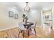 Bright dining room with hardwood floors and updated lighting near the kitchen makes for easy entertaining and dining at 19070 White Fawn Dr, Monument, CO 80132
