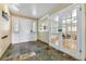 Welcoming entryway with slate flooring, double doors, and ample natural light at 19070 White Fawn Dr, Monument, CO 80132