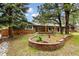 Lovely home with blue siding, brick accents, a quaint garden, and mature trees at 19070 White Fawn Dr, Monument, CO 80132