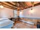 Interior of the shed featuring tile floors, wooden beams, a ceiling fan, and ample counter space at 19070 White Fawn Dr, Monument, CO 80132