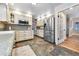 Spacious kitchen with stainless steel appliances, custom cabinetry, and ample counter space, perfect for cooking and gatherings at 19070 White Fawn Dr, Monument, CO 80132