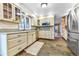 Well-appointed kitchen with bright cabinets, stainless steel appliances, and a functional layout for culinary enthusiasts at 19070 White Fawn Dr, Monument, CO 80132