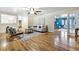 Spacious living room with hardwood floors, neutral decor, and open floor plan at 19070 White Fawn Dr, Monument, CO 80132