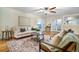 Cozy living room with hardwood floors, stylish seating, and natural light at 19070 White Fawn Dr, Monument, CO 80132
