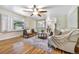 Bright living room with hardwood floors, stylish furniture, and natural light at 19070 White Fawn Dr, Monument, CO 80132