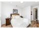 Bright bedroom with light wood floors and minimalist decor at 4243 E 8Th Ave, Denver, CO 80220