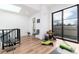 An open concept bonus room with a skylight and sliding door access to the outdoor patio at 4243 E 8Th Ave, Denver, CO 80220