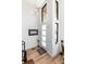 Bright, modern foyer with hardwood floors, contemporary lighting, and tall windows at 4243 E 8Th Ave, Denver, CO 80220