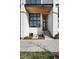 Modern home featuring a striking facade, concrete steps, and a minimalist entrance at 4243 E 8Th Ave, Denver, CO 80220