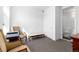 Inviting office space with carpet flooring, a comfortable seating area, and a convenient half bathroom at 4243 E 8Th Ave, Denver, CO 80220