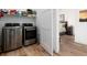 Efficient laundry room with modern washer and dryer units and convenient access to the bedroom at 4243 E 8Th Ave, Denver, CO 80220