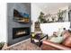Comfortable living room featuring a modern fireplace, hardwood floors, and stylish décor at 4243 E 8Th Ave, Denver, CO 80220