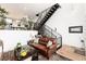 Beautiful living room with adjacent stairwell and hardwood floors at 4243 E 8Th Ave, Denver, CO 80220