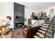 Cozy living room with a modern fireplace, hardwood floors, and stylish decor at 4243 E 8Th Ave, Denver, CO 80220