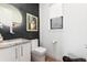 Chic powder room featuring a modern vanity, unique accents, and stylish décor for a touch of elegance at 4243 E 8Th Ave, Denver, CO 80220