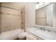 Cozy bathroom featuring a shower-tub combo, sleek vanity, and modern fixtures at 595 Manhattan Dr # 203, Boulder, CO 80303