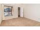 Comfortable bedroom with closet space, a bright window, and soft carpeting at 595 Manhattan Dr # 203, Boulder, CO 80303