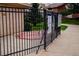 Community hot tub behind a metal fence with posted rules and regulations for community residents at 595 Manhattan Dr # 203, Boulder, CO 80303