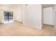 Bright living room featuring a sliding glass door with private balcony access at 595 Manhattan Dr # 203, Boulder, CO 80303