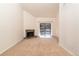 Cozy living area with a fireplace and sliding glass doors to a private balcony at 595 Manhattan Dr # 203, Boulder, CO 80303