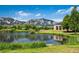 Scenic view of the pond and Flatirons with a building in the background at 595 Manhattan Dr # 203, Boulder, CO 80303
