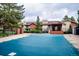 Community pool featuring a large in-ground pool covered for the off season with brick perimeter and nearby condos at 595 Manhattan Dr # 203, Boulder, CO 80303
