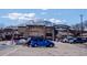Shopping center with the Flatirons in the background on a beautiful day at 595 Manhattan Dr # 203, Boulder, CO 80303