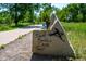 Well maintained walking trail with stone marker surrounded by lush greenery at 595 Manhattan Dr # 203, Boulder, CO 80303
