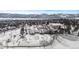 Overhead shot of a community center in winter with a snow-covered landscape and mountain backdrop at 10703 W Turtle Mtn, Littleton, CO 80127