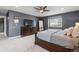 Comfortable bedroom featuring a ceiling fan, dresser with TV, and a window for natural light at 10703 W Turtle Mtn, Littleton, CO 80127