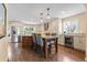 Bright kitchen showcasing a center island with seating, stainless steel appliances, and a wine cooler at 10703 W Turtle Mtn, Littleton, CO 80127