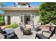 Backyard with fire pit and seating area; French doors lead inside from the exterior at 3109 E Warren Ave, Denver, CO 80210