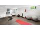Finished basement offering an open space, with a gym area and workout equipment at 3109 E Warren Ave, Denver, CO 80210