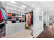 Walk-in closet with custom shelving and ample storage for clothing and accessories at 3109 E Warren Ave, Denver, CO 80210
