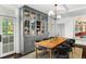 Elegant dining area with hardwood floors, a built-in china cabinet, and views to the outside at 3109 E Warren Ave, Denver, CO 80210